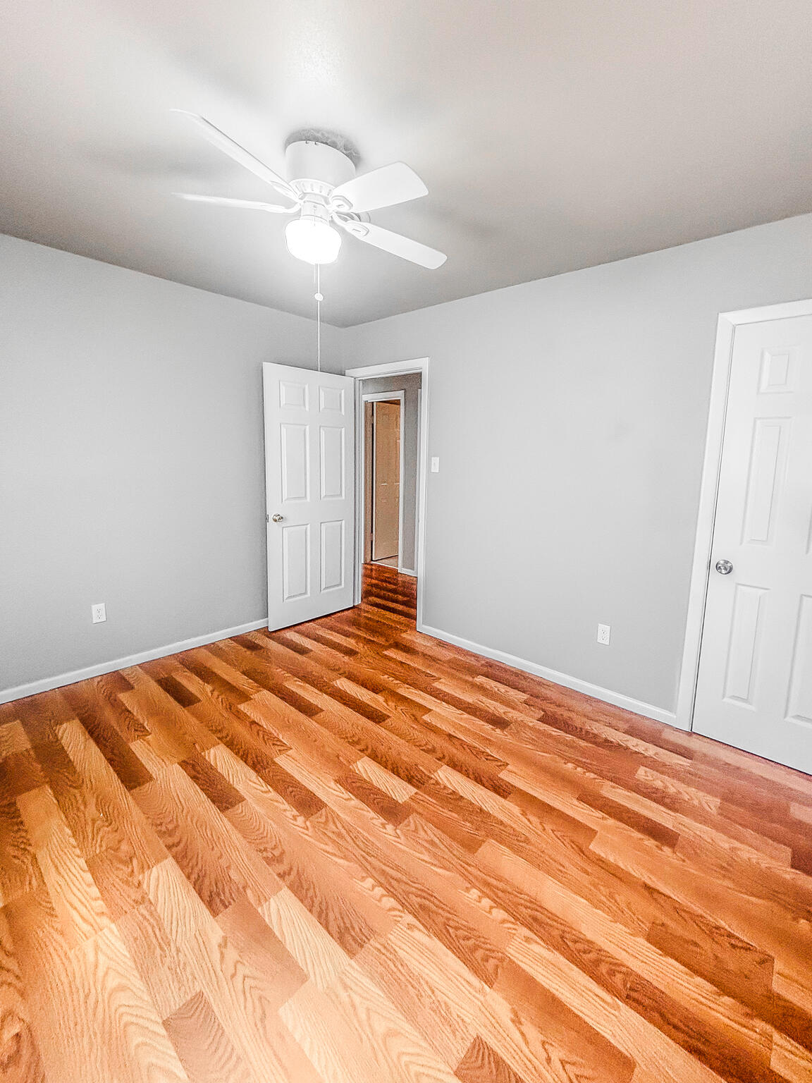 505 East 37th Street Lubbock, TX 79404 - Photo 21 of 25 a bedroom with a bed and a chandelier