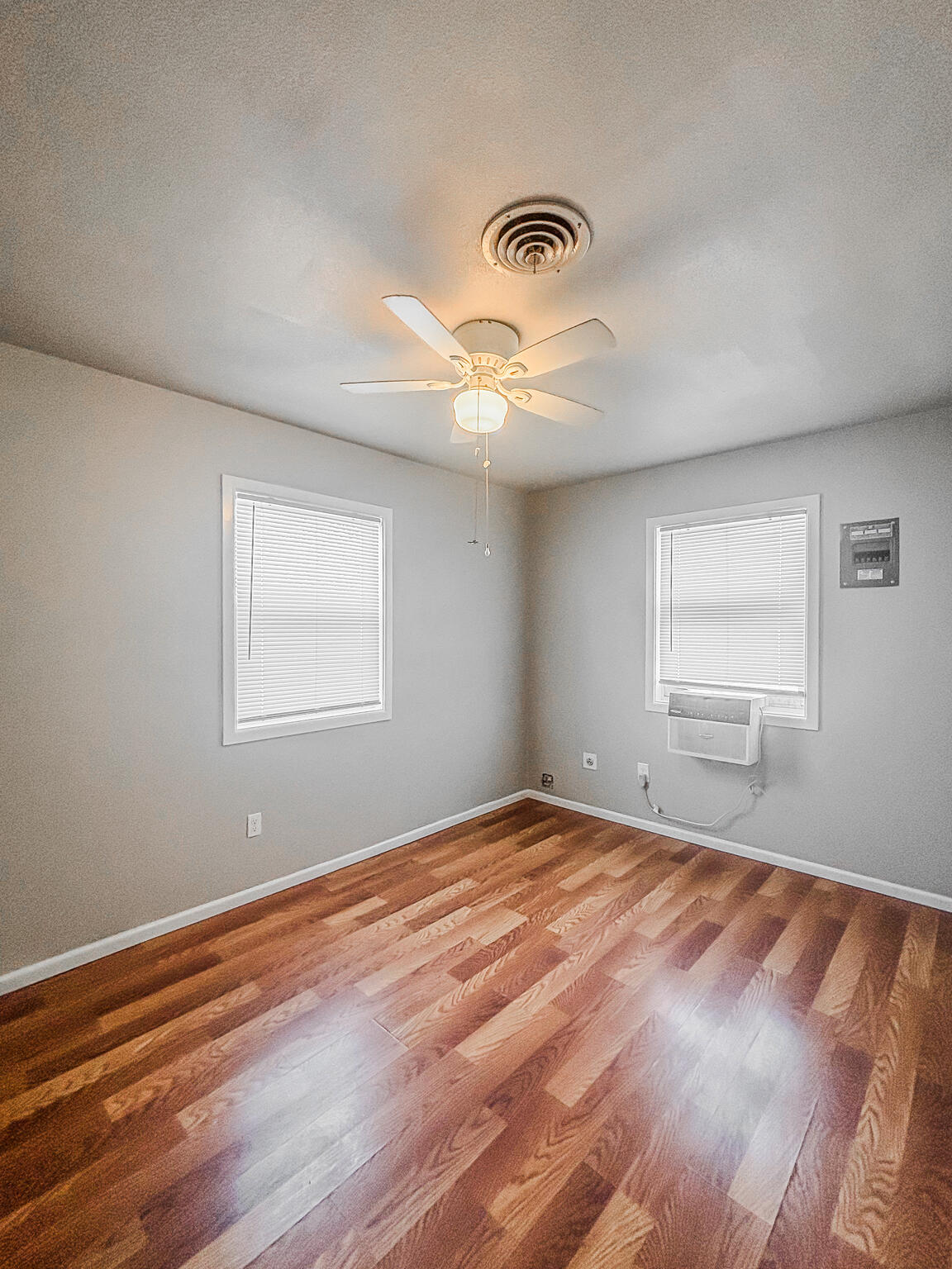 505 East 37th Street Lubbock, TX 79404 - Photo 23 of 25 a view of an empty room with wooden floor and a window