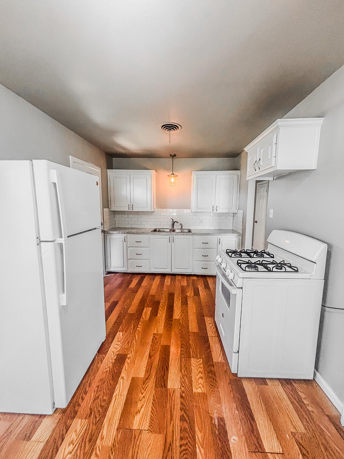 505 East 37th Street Lubbock, TX 79404 - Photo 6 of 25 a kitchen with stainless steel appliances granite countertop a refrigerator and a stove top oven