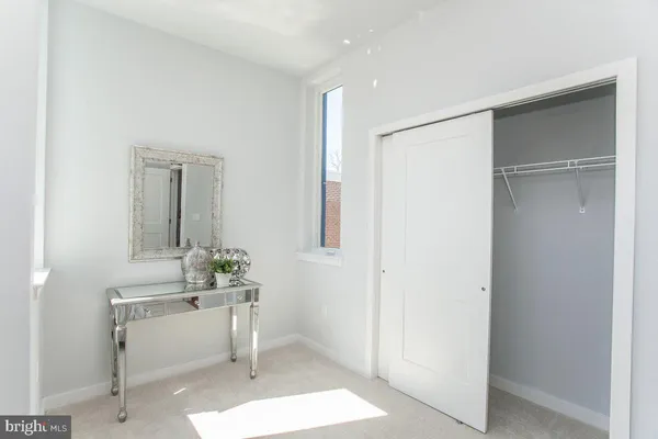 a room with table and mirror