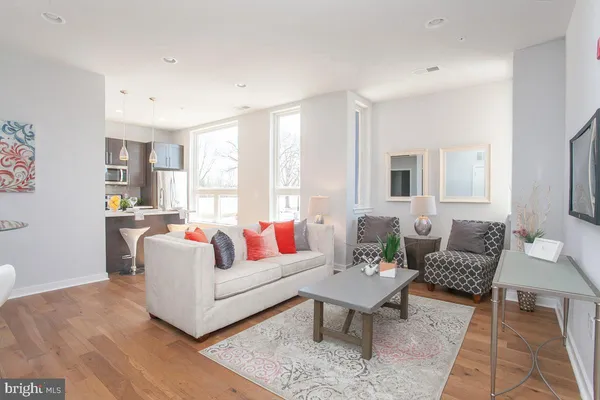 a living room with furniture and a large window