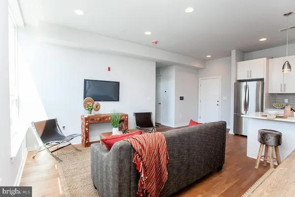 a bed room with a bed and a television