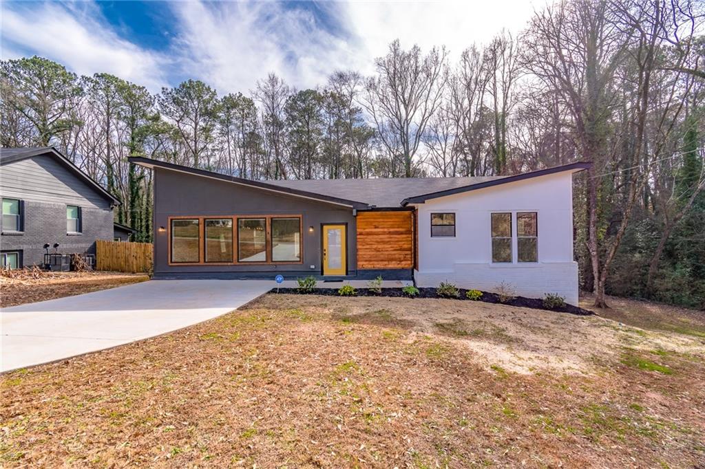 2399 Fair Lane Decatur, GA 30032 - Photo 1 of 1 a view of a house with backyard and trees