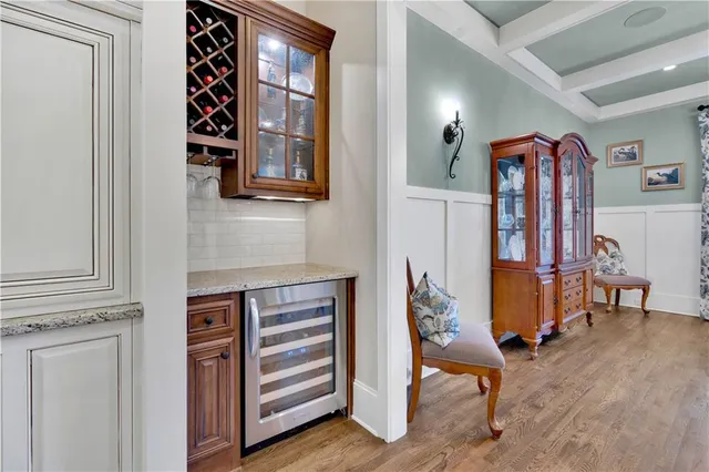 a kitchen with stainless steel appliances granite countertop a stove and a refrigerator