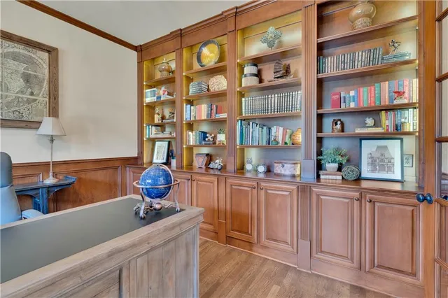 a kitchen with stainless steel appliances granite countertop a kitchen island a stove and a white cabinets