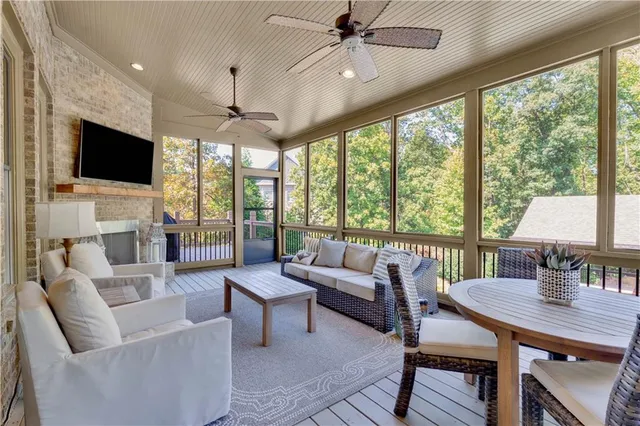 a bathroom with a granite countertop sink a toilet and a mirror