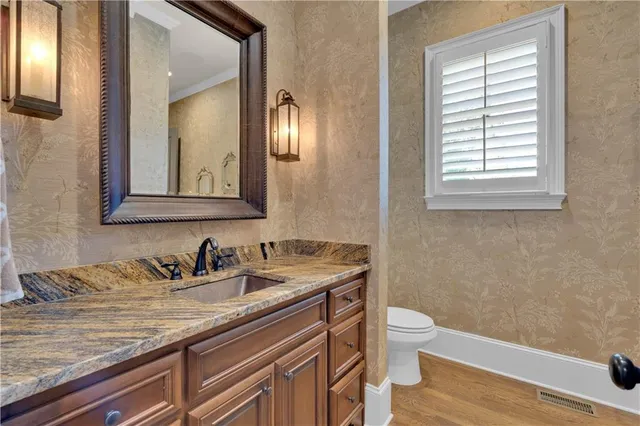 a living room with furniture a fireplace and a chandelier
