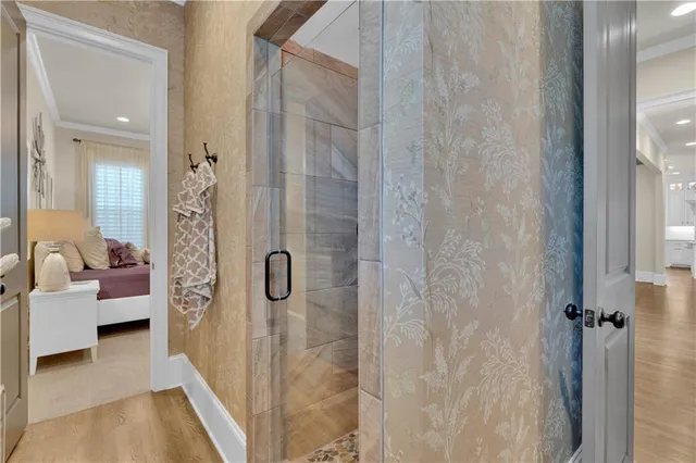 a living room with fireplace furniture and a large window