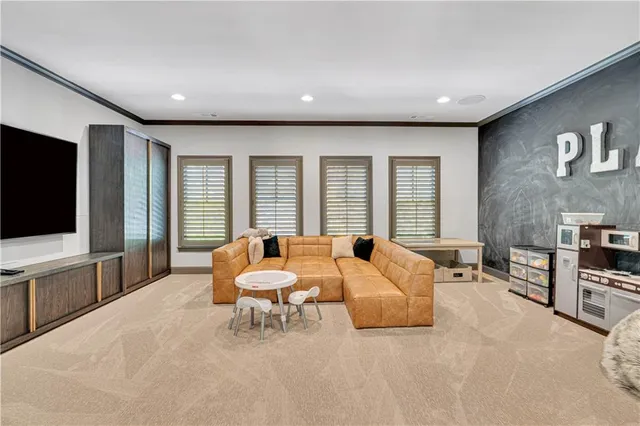 a view of a chairs and table in the backyard