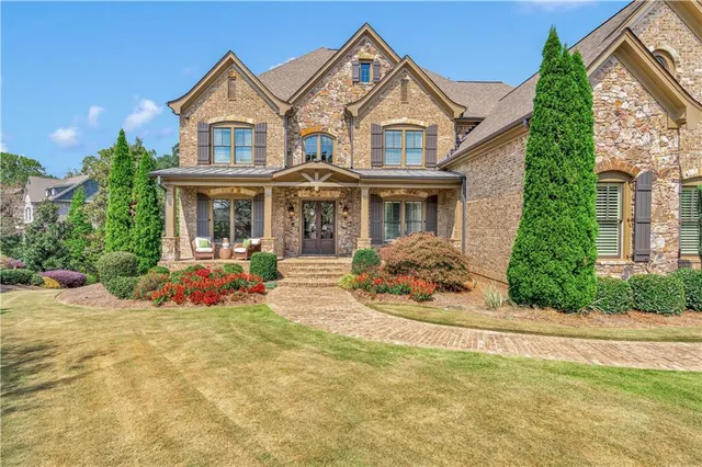 front view of a house with a yard