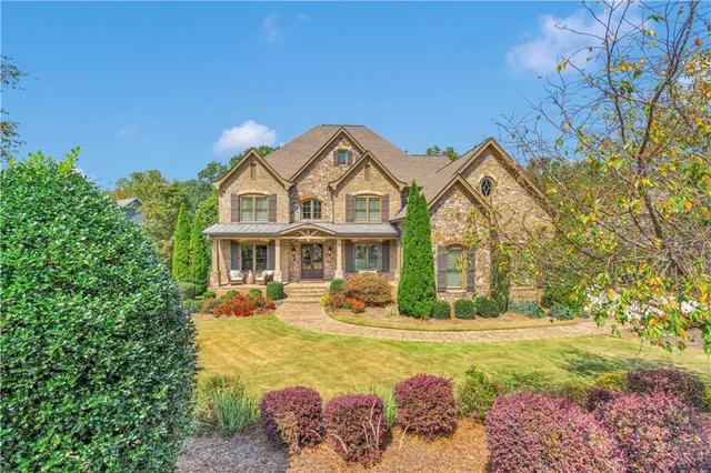 a view of a dining room with furniture and a floor to ceiling window