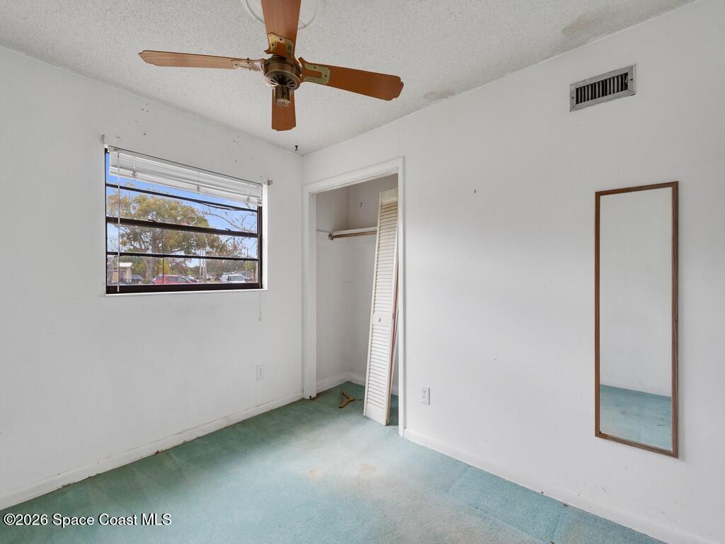 1076 Madrid Road Rockledge, FL 32955 - Photo 16 of 30 a view of empty room with window