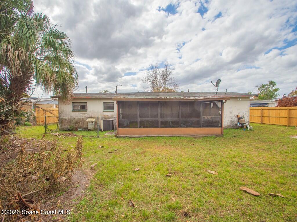 1076 Madrid Road Rockledge, FL 32955 - Photo 23 of 30 front view of a house with a yard