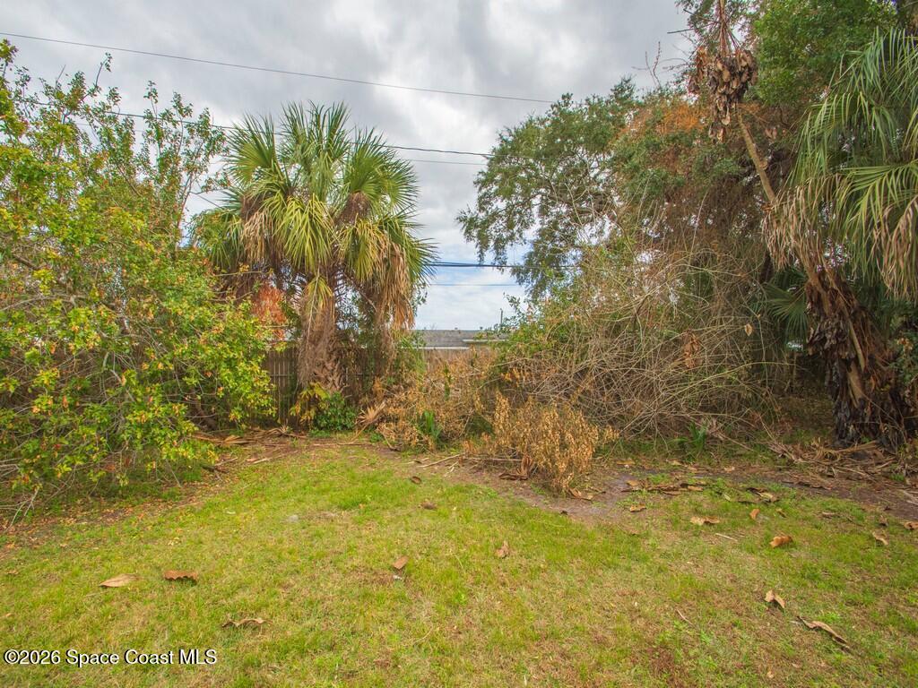 1076 Madrid Road Rockledge, FL 32955 - Photo 29 of 30 a view of a pathway both side of house
