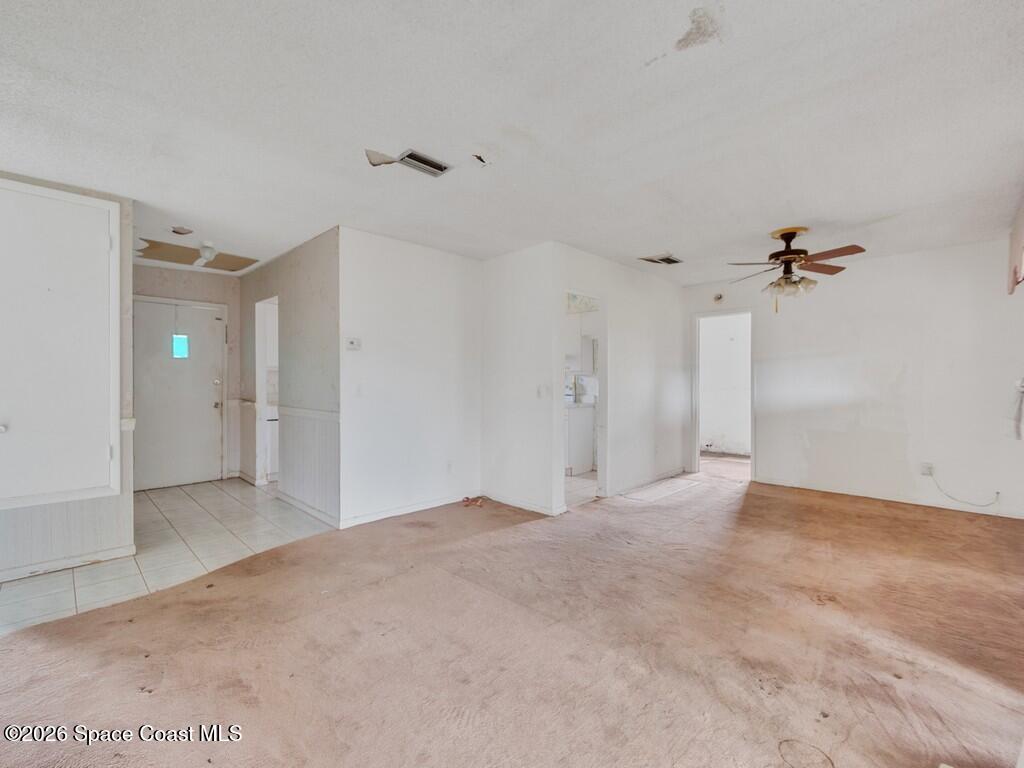 1076 Madrid Road Rockledge, FL 32955 - Photo 8 of 30 a view of empty room with a ceiling fan