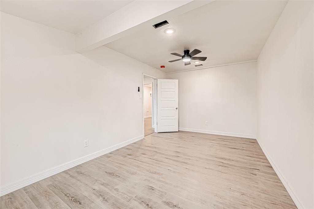 7010 South Hall Street Houston, TX 77028 - Photo 11 of 33 a view of an empty room with a ceiling fan