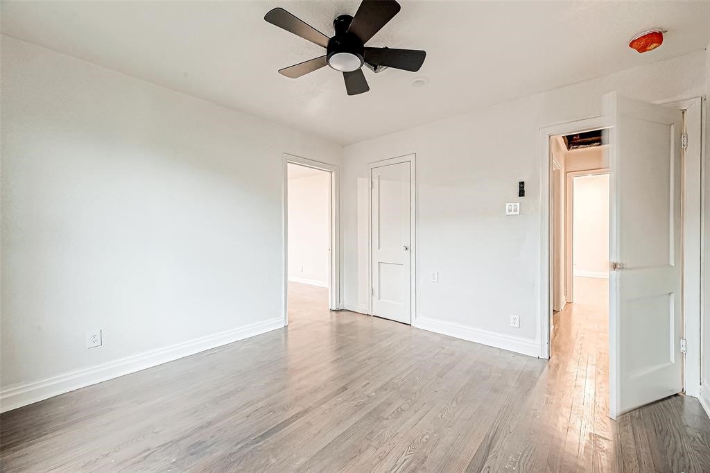 7010 South Hall Street Houston, TX 77028 - Photo 27 of 33 a view of a room with wooden floor and a ceiling fan