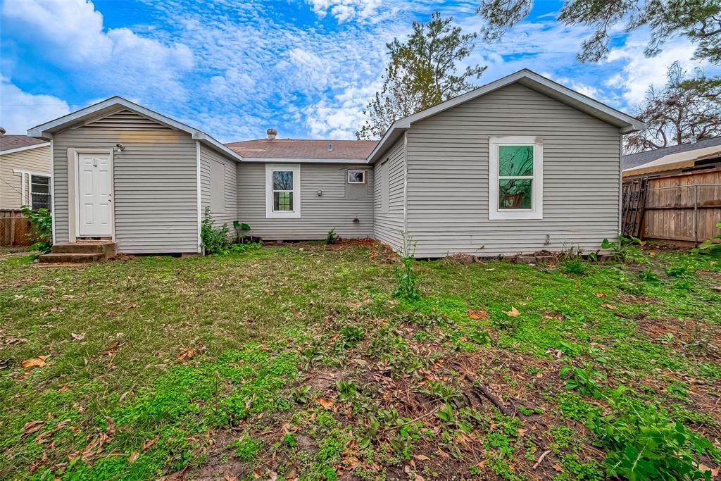 7010 South Hall Street Houston, TX 77028 - Photo 33 of 33 a view of a house with yard and a garden