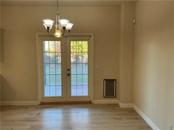 a view of entryway with wooden floor