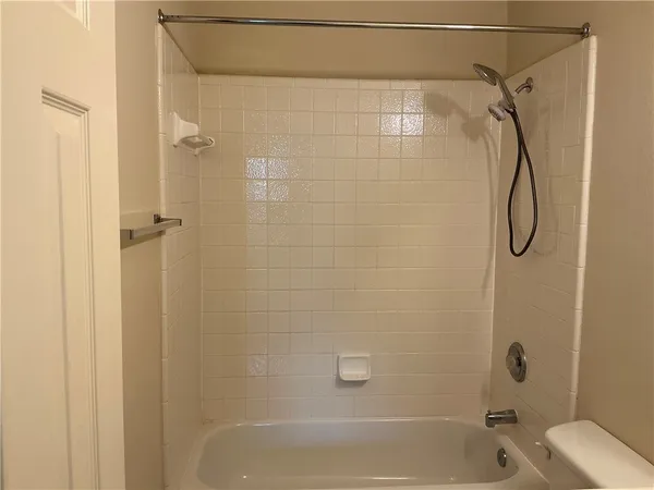 a bathroom with a shower and a shower