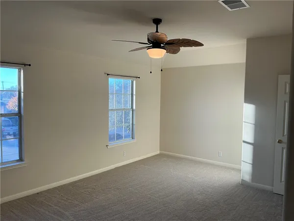 a front view of a house with a yard garage and outdoor seating