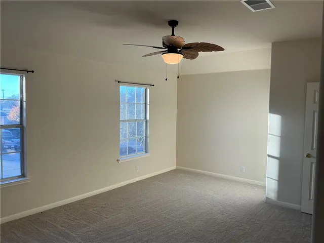 a front view of a house with a yard garage and outdoor seating