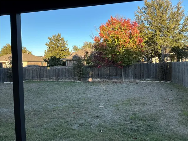 an empty room with a empty space and windows