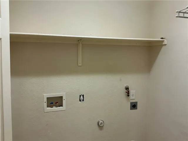 a bathroom with a sink a large mirror and a shower