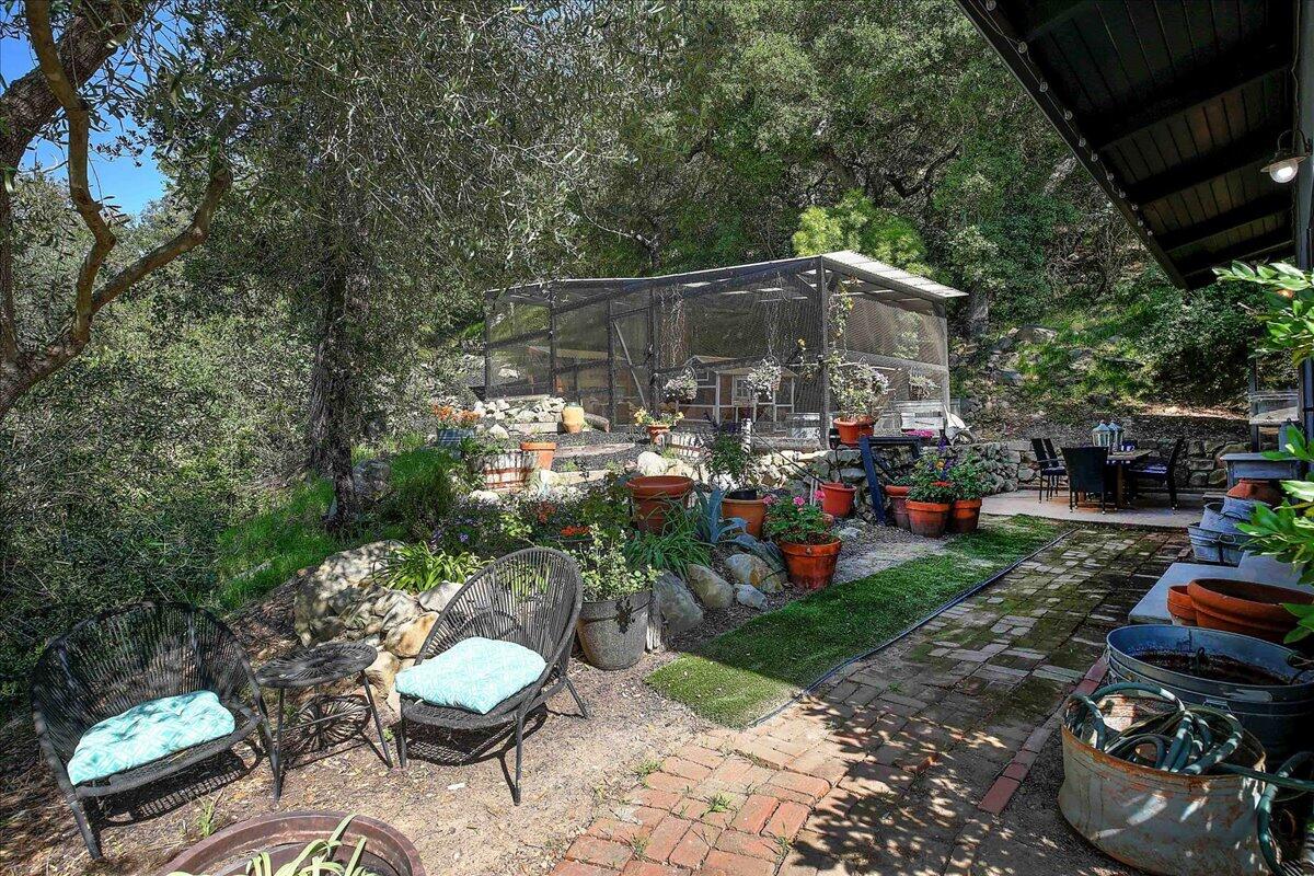 2253 Las Canoas Road Santa Barbara, CA 93105 - Photo 30 of 53 a view of a chair and tables in backyard