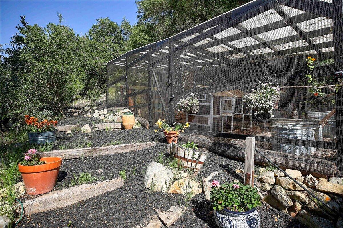 2253 Las Canoas Road Santa Barbara, CA 93105 - Photo 31 of 53 a outdoor view of a patio with dining table and chairs