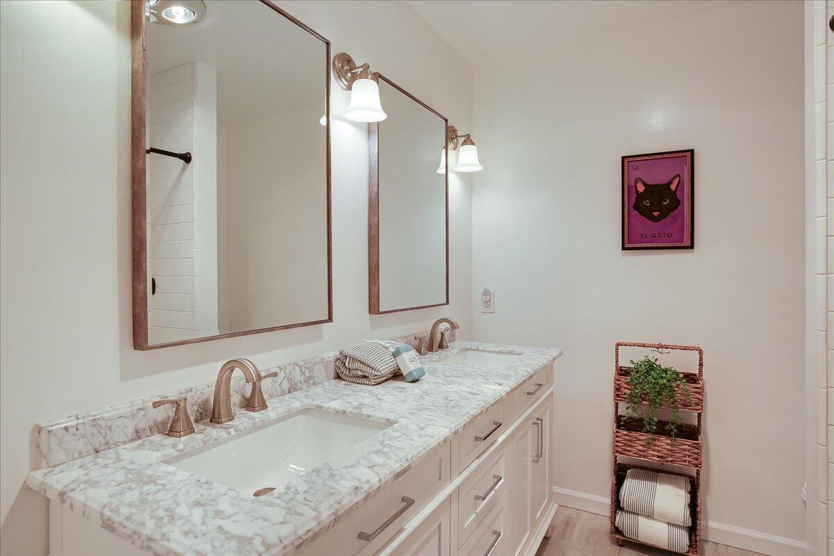 2253 Las Canoas Road Santa Barbara, CA 93105 - Photo 33 of 53 a bathroom with a granite countertop sink and a mirror