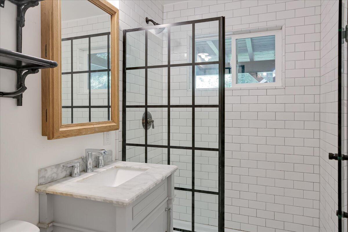 2253 Las Canoas Road Santa Barbara, CA 93105 - Photo 39 of 53 a bathroom with a sink mirror and vanity