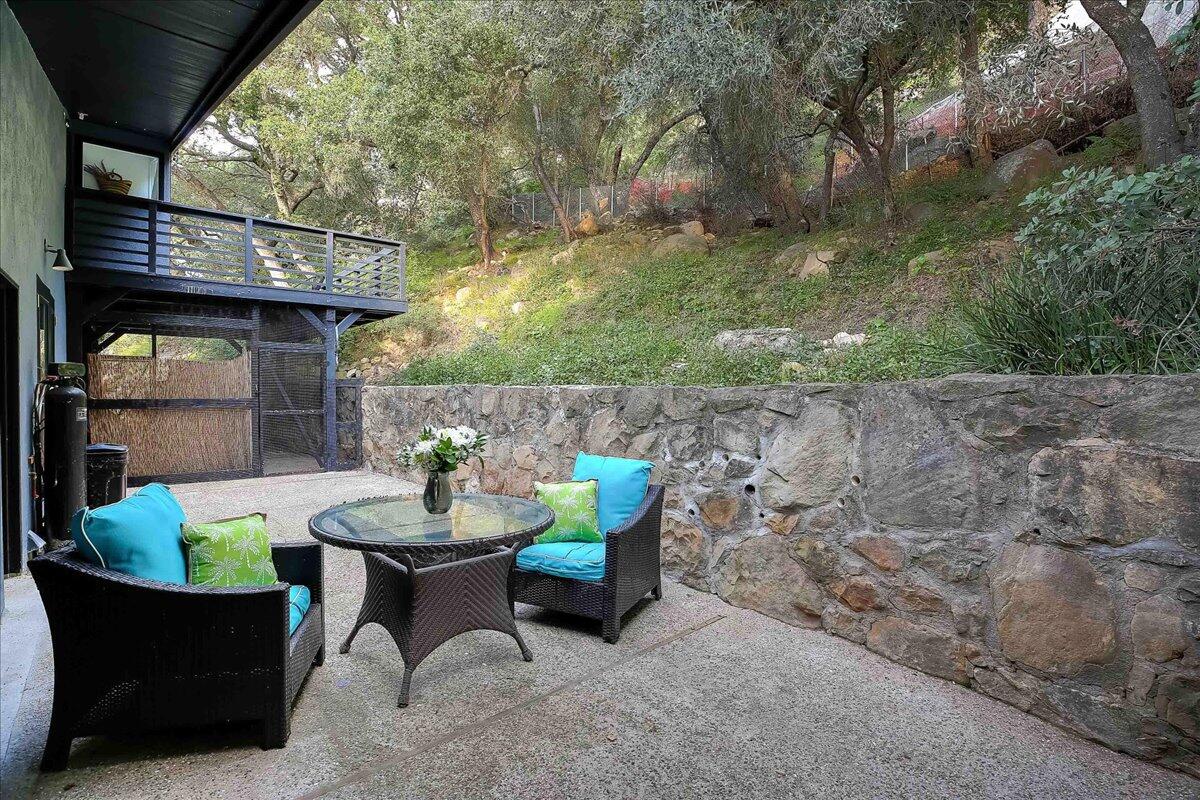 2253 Las Canoas Road Santa Barbara, CA 93105 - Photo 40 of 53 a backyard of a house with table and chairs