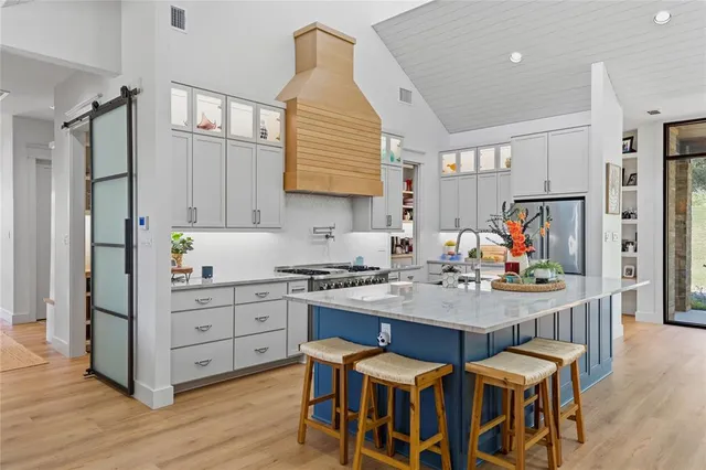a view of kitchen with cabinets and wooden floor