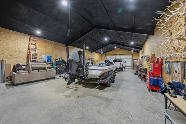 a view of a dining room with furniture and a chandelier
