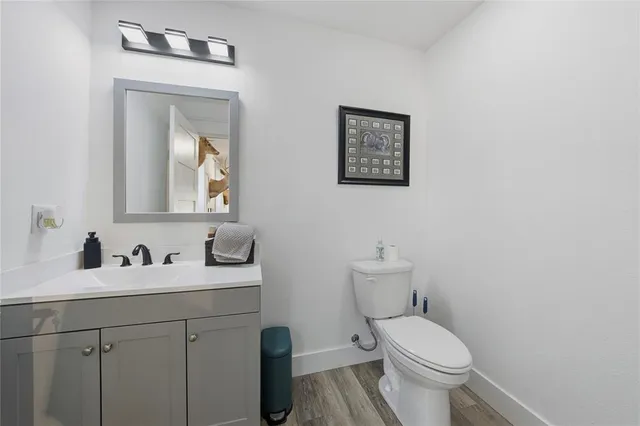 a view of a two chairs in the patio next to a yard