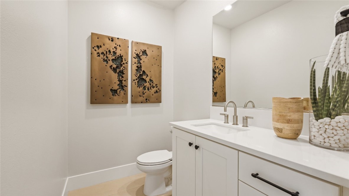 4971 Rideline Road Yorba Linda, CA 92887 - Photo 11 of 33 a bathroom with a toilet sink and mirror