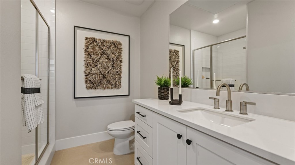 4971 Rideline Road Yorba Linda, CA 92887 - Photo 19 of 33 a bathroom with a granite countertop sink toilet and shower