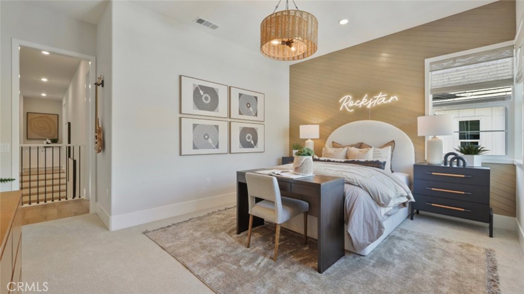 4971 Rideline Road Yorba Linda, CA 92887 - Photo 22 of 33 a bedroom with a bed and a chandelier