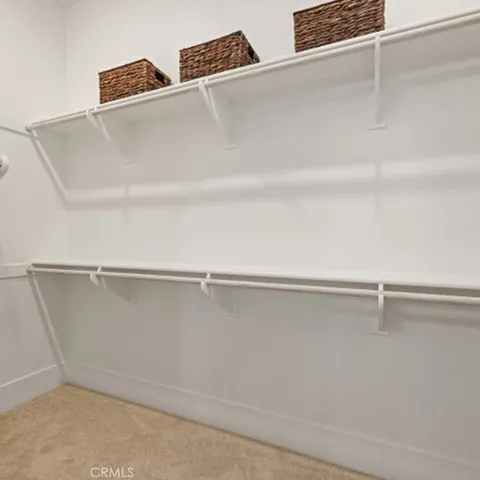 a utility room with closet dryer and washer