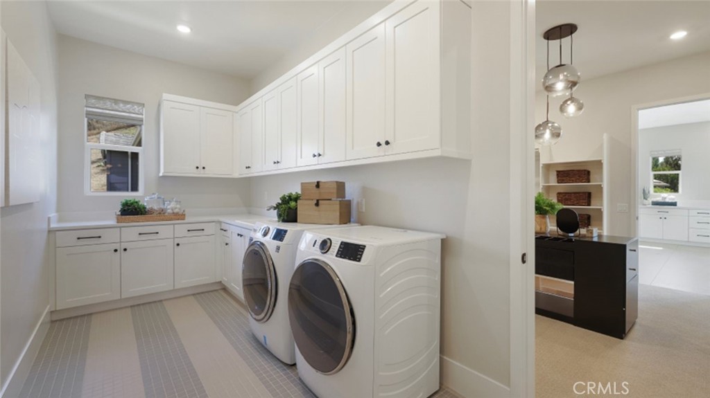 4971 Rideline Road Yorba Linda, CA 92887 - Photo 31 of 33 a utility room with cabinets washer and dryer