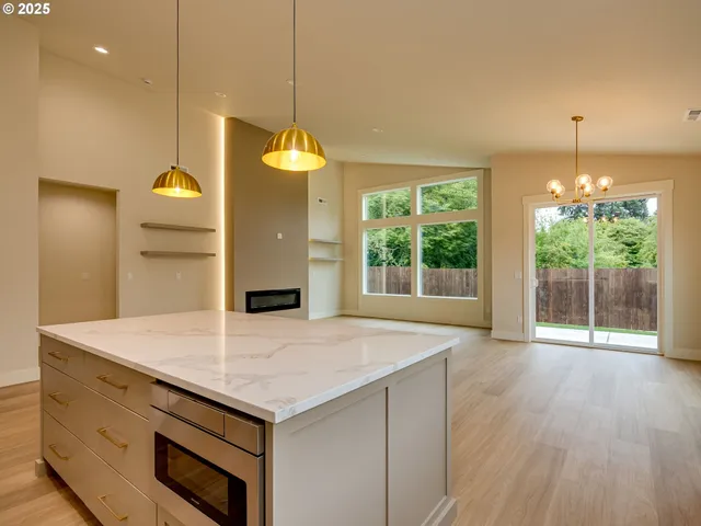 a kitchen with a sink and large window