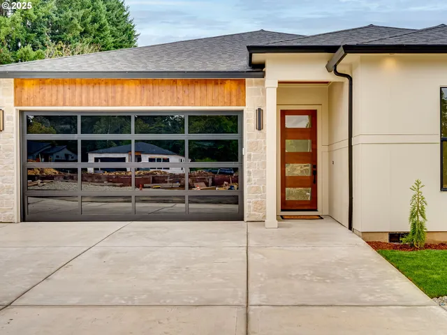 a view of a house with cars