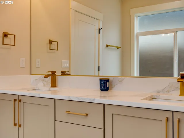a bathroom with a tub sink and mirror
