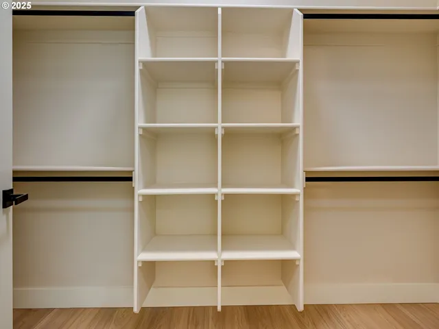 a bedroom with a large bed and a large window