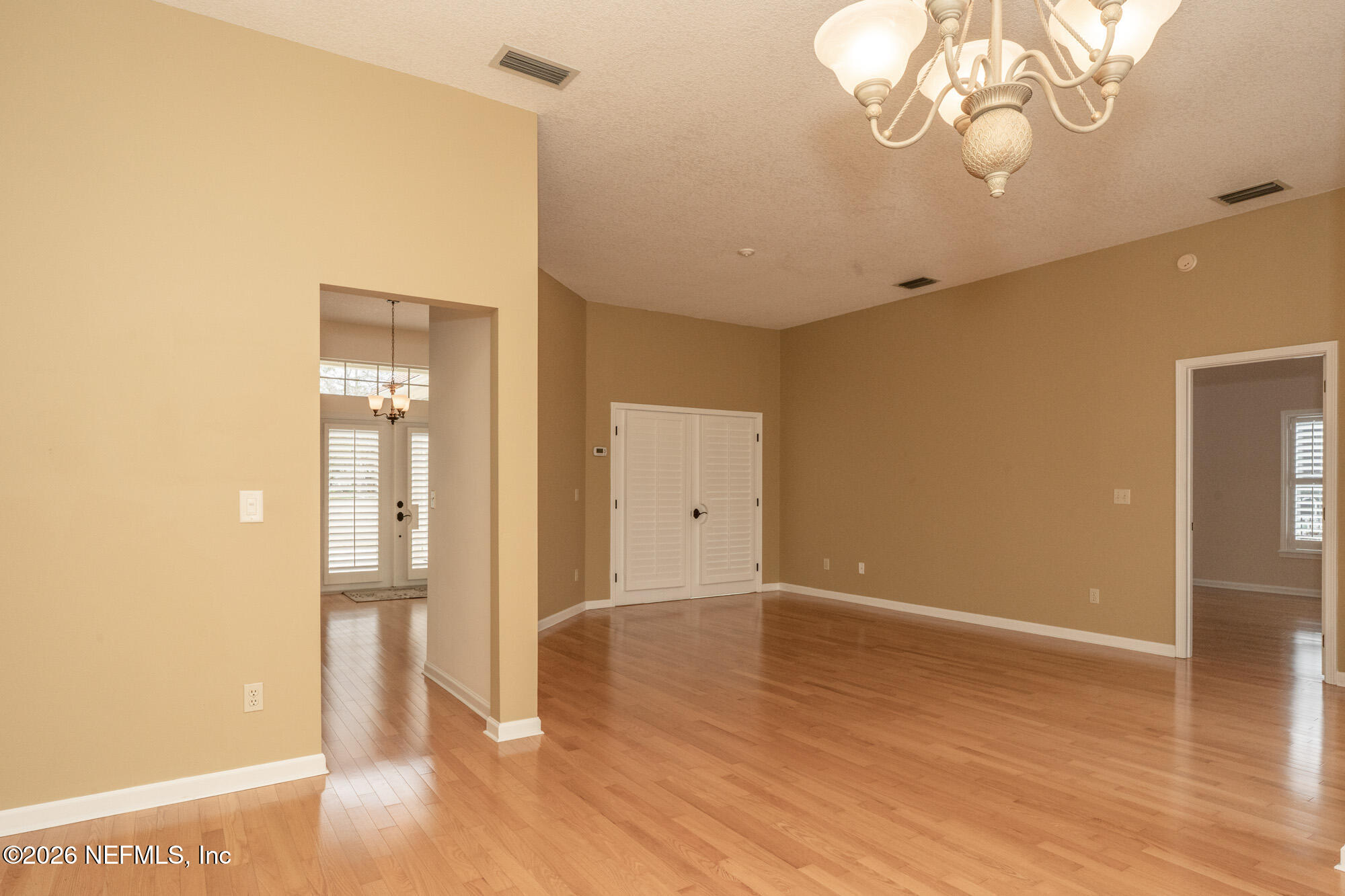 13177 Cricket Cove Road North Jacksonville, FL 32224 - Photo 11 of 39 wooden floor in an empty room with a window