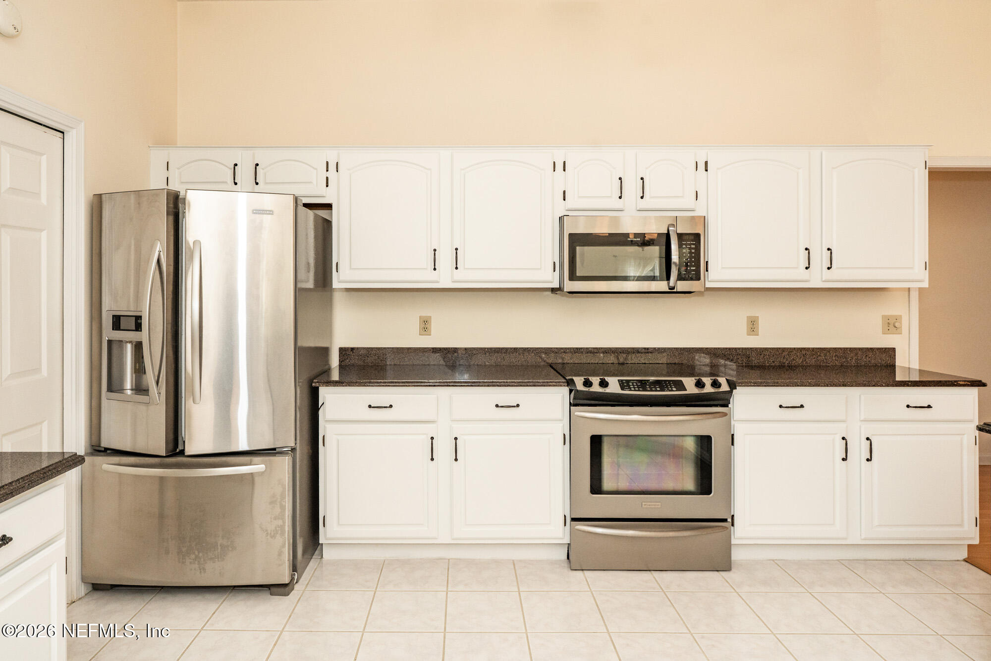 13177 Cricket Cove Road North Jacksonville, FL 32224 - Photo 12 of 39 a kitchen with cabinets stainless steel appliances and a counter space
