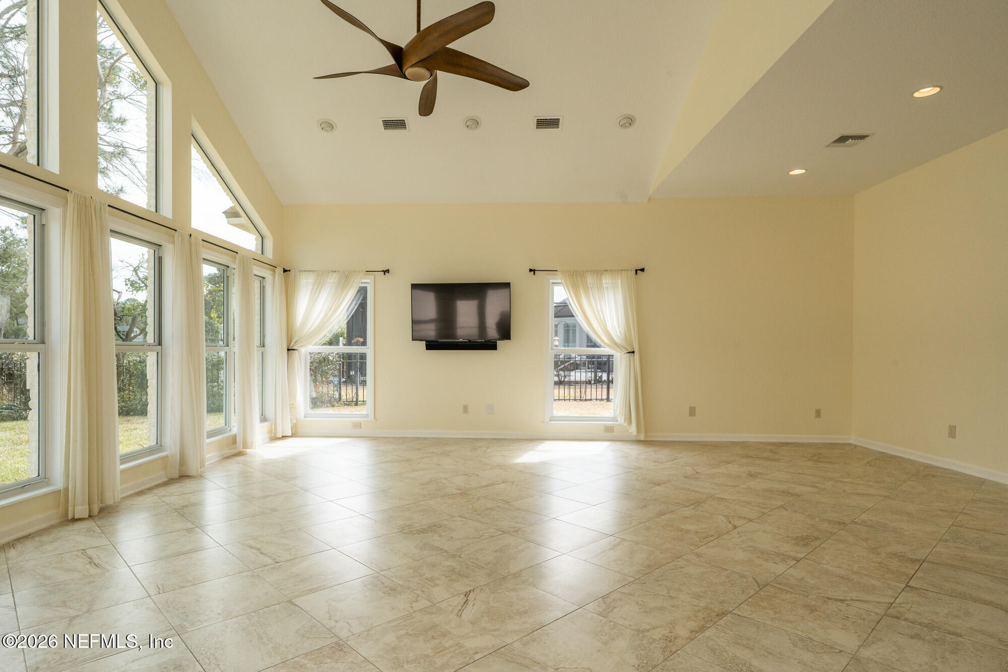 13177 Cricket Cove Road North Jacksonville, FL 32224 - Photo 22 of 39 a view of a hallway with wooden floor and a living room