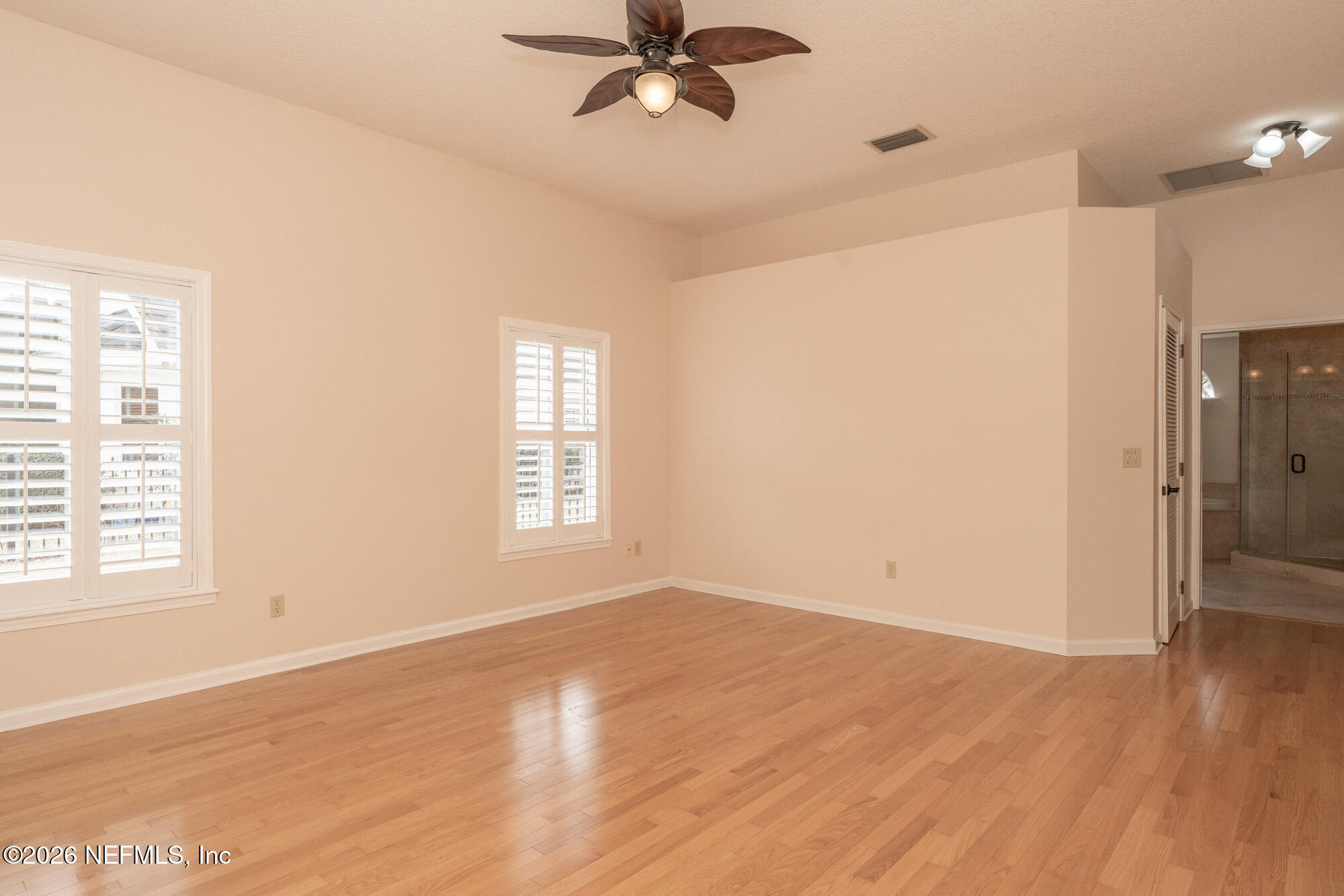 13177 Cricket Cove Road North Jacksonville, FL 32224 - Photo 24 of 39 a view of empty room with wooden floor and fan
