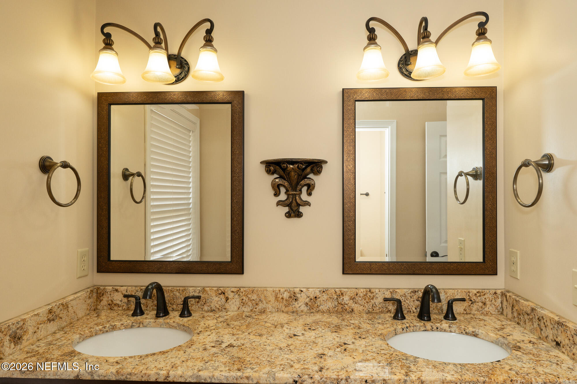 13177 Cricket Cove Road North Jacksonville, FL 32224 - Photo 30 of 39 a bathroom with a granite countertop sink and a mirror